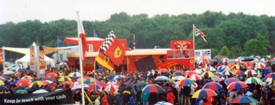 Jacques Villeneuve addresses a huge crowd around the Winfield simulator at Silverstone